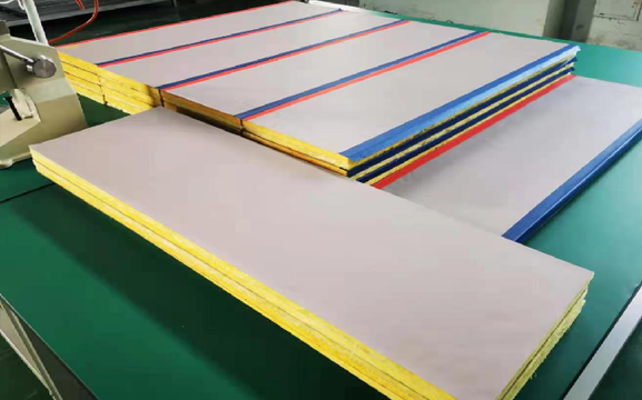 Glass wool insulation material being handled