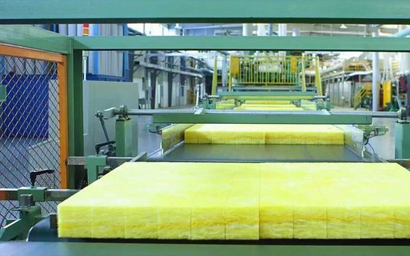 Glass wool insulation material being handled